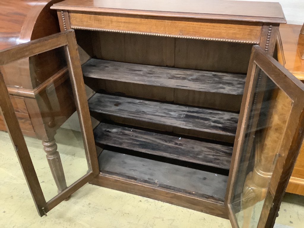 An early 20th century oak pier cabinet, width 90cm depth 28cm height 104cm